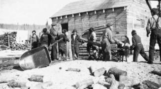 School children stacking wood for the winter