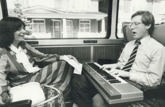 Arlene Perly Rae is serenaded by husband Bob on the NDP leader's bus