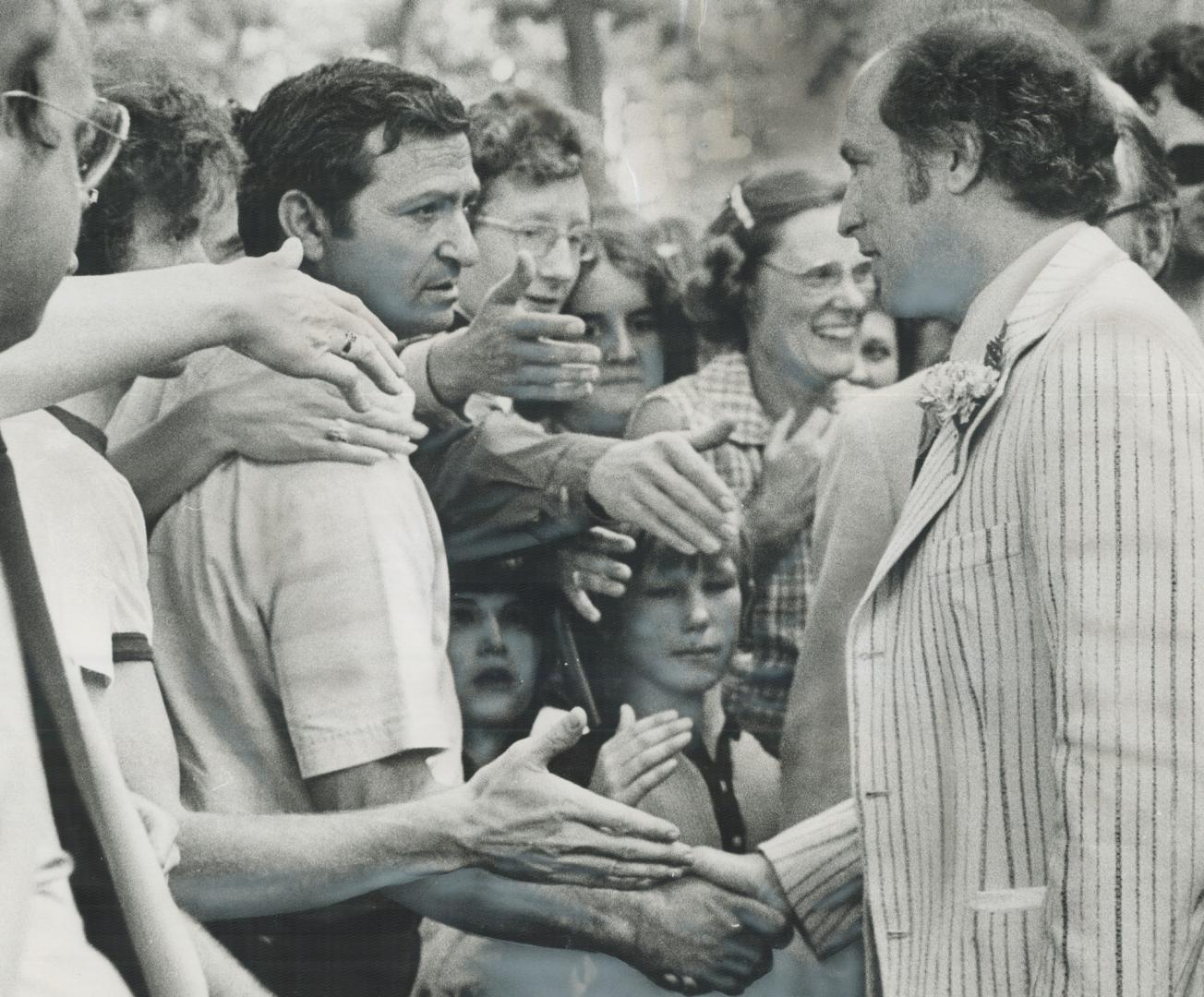 Hands eager to be shaken continue to greet Prime Minister Pirerre Trudeau on campaign trail, which yesterday led to Brantford, Ont. An estimated 5,000(...)