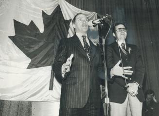 Trudeau and the Maple Leaf flag he uses as a backdrop for his campaign speeches