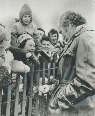 Throng of children greet Prime Minister Pierre Trudeau today as he arrived by helicopter at Brantfoprd's Pauline Johnson High School