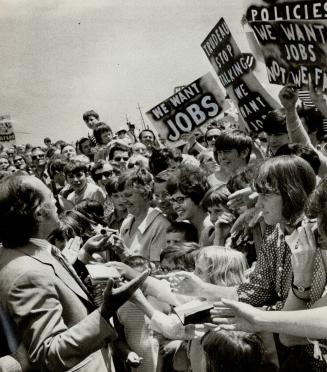 They booed and waved placards demanding jobs when Prime Minister Pierre Trudeau showed up at the Bramalea Arena today to attend a birthday party to ce(...)