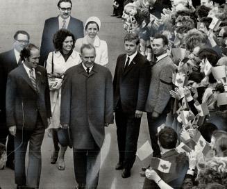 USSR Premier Alexei Kosygin (right) and crowd waving Canadian flags greeted the Prime Minister and Mrs