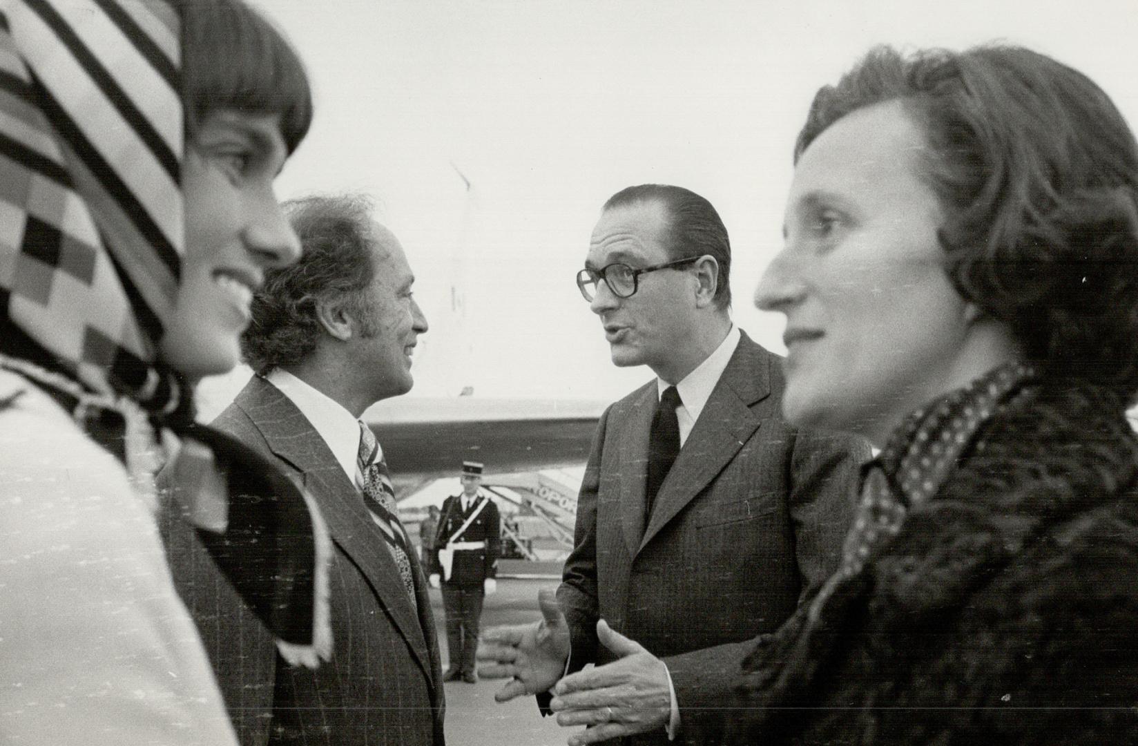 French Premier Jacques Chirac and his wife (r) welcom Canadian Prime Minister Pierre Trudeau and his wife Margaret (l) at Orly airfield this morning