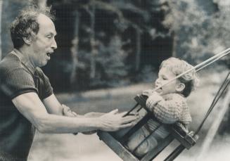 Youngest Trudeau, 21-month-old Michel, gets push from his Prime Minsiter father on the toddler's swing yesterday