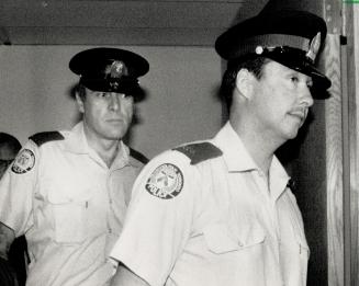 After the verdict: Metro Constables Gordon Trumbley (left) and Rodney Pugh leave the tribunal yesterday after being found guilty of discreditable conduct