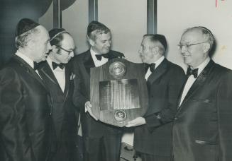 Humanitarian Award of the Beth Sholom Brotherhood was presented to Justice Minister John Turner last night