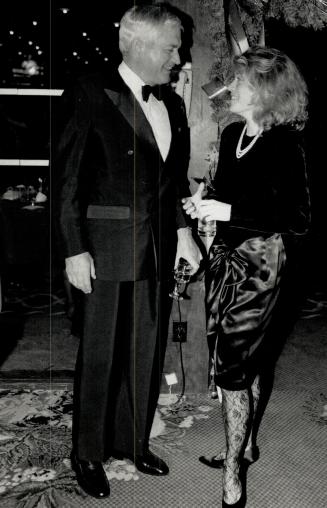 Above, Liberal leader John Turner shares a quiet moment with daughter Elizabeth, who is wearing a black velvet and silk dress with black lace stocking(...)