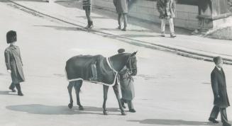 Reversed boots in the stirrups are only one of the tributes Canada paid Governor-General George Vanier during his state funeral yesterday. This honore(...)