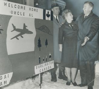 Home from Vietnam, Dr. Alje Vennema (right), Director of Canada's Medical Mission to Vietnam for 4 years greets his sister-in-law and brother Gerald a(...)