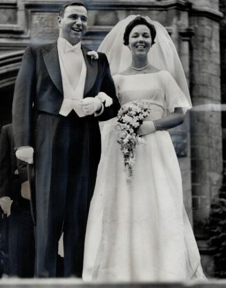 Mr. and Mrs. William Mckeough shown after their marriage last night in Trinity College Chapel. Mrs. McKeough was formerly Margaret Joyce Walker