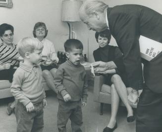 Mark Lavine and Victor Fleishman get candy from James Walker