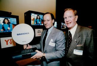 Small competitor: Rogers Cable chief Colin Watson, above, displays satellite dish that may soon sit on your window ledge