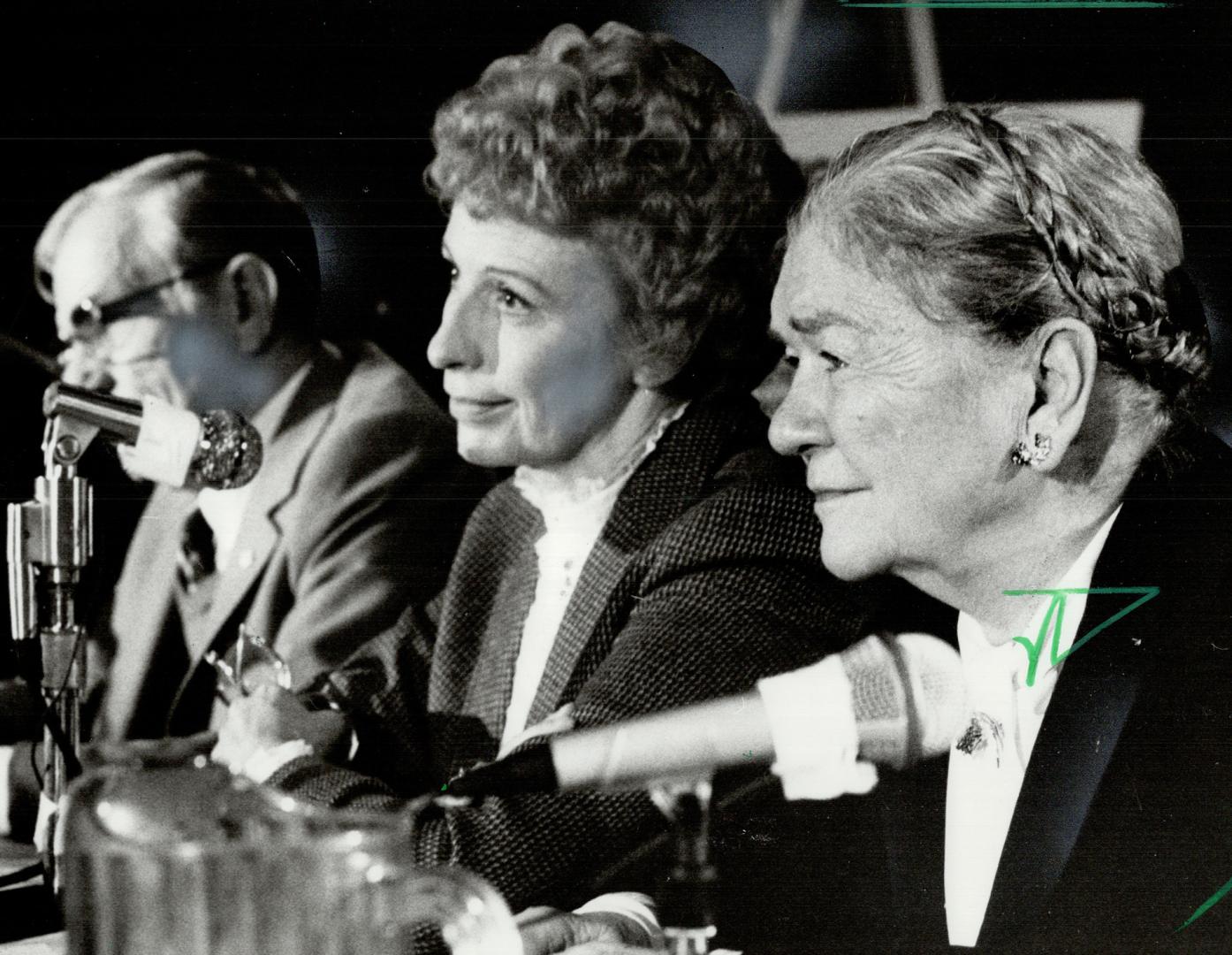 All ears: Chairman Joan Watson, left, and panel member Pauline McGibbon, former lieutenant-governor of Ontario, listen intently at a hearing into health care allocation in Toronto yesterday