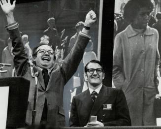 Provincial secretary Robert Welch raises his arms to respond to applause after his speech to Progressive Conservative leadership convention last night(...)