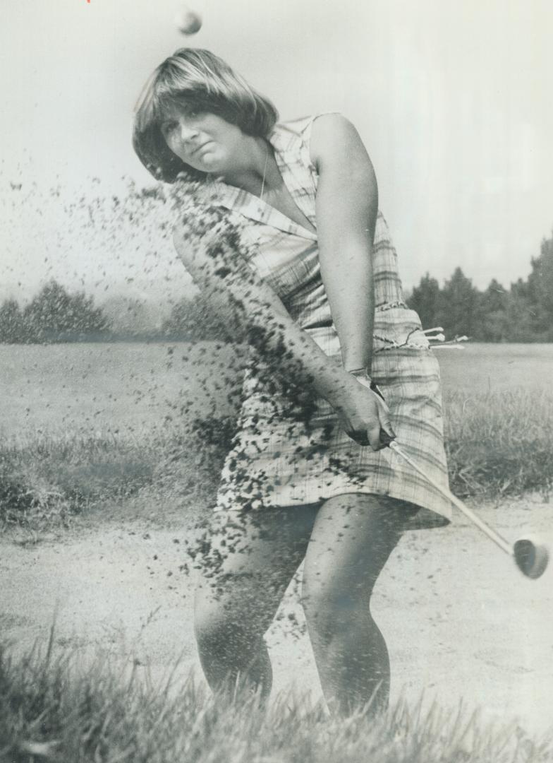 On target: Stacy West, 18, blasts ball out of Bayview Country Club bunker in practice for defence of second Canadian junior golf title