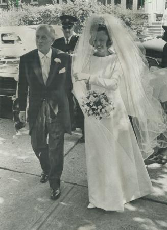 With her father, international industrialists Garfield Weston, Camilla arrives at St