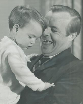 Looking for hidden assets--like candy -- 2-year-old Emily White rummages in pocket of her father, MPP John White (PC--London South), right after he wa(...)