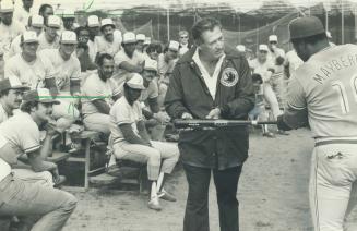 Sweet spot: Baseball's last 400 hitter, Ted Williams, explains the science to Blue Jay slugger and first baseman John Mayberry at a special clinic held at the Dunedin training camp yesterday