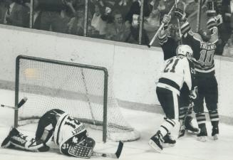 All even: Oilers' Jari Kurri congratulates Esa Tikkanen after Tikkenen scored the winning goal late in the third period, much to the chagrin of Leaf goalie Ken Wregget and Borje Salming