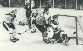 Oops, missed that one: Toronto goaltender Ken Wregget, fearing the worst, glances over his puck out of midair to narrow Leafs' lead to 3-2, but the homeside went on for an 8-4 win