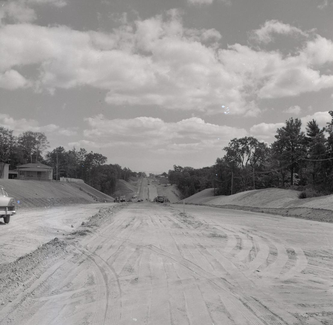 Bathurst St., looking south, south of Ellerslie Avenue, across West Don River during construction of causeway. Toronto, Ontario