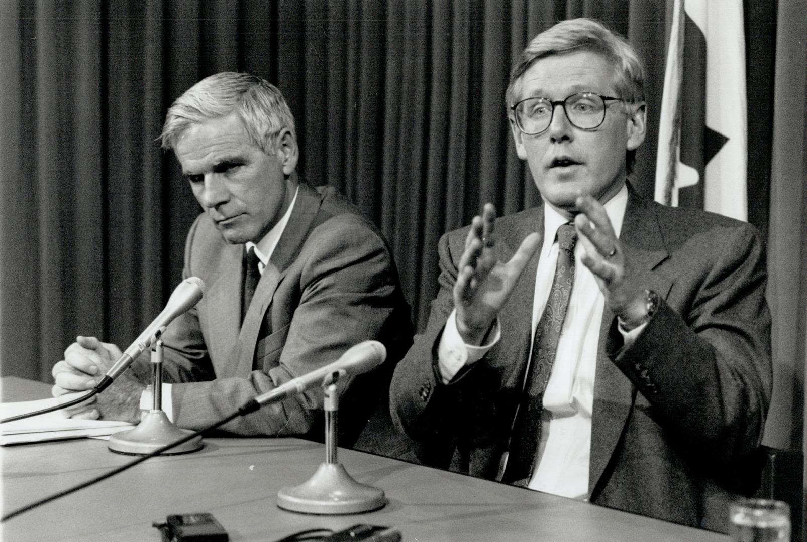 On the spot: Ontario Treasurer Floyd Laughren, left, listens as Premier Bob Rae answers a reporter's question