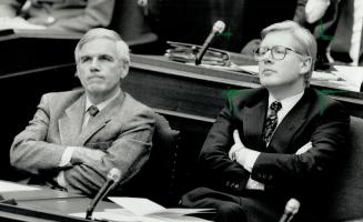 Wise words: Treasurer Floyd Laughren, left, and Premier Bob Rae listen attentively yesterday as NDP's agenda is outlined in Legislature