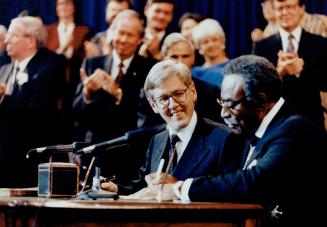 Into power: Bob Rae, left, is sworn in as Premier today by Lieutenant-Governor Lincoln Alexander