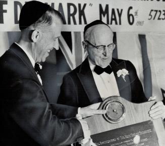 Beth Sholom Synagogue annual Brotherhood Award is presented (photo left) by Dean Ivan C