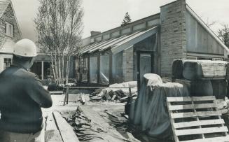 Luxury Closed-In Pool on the property of industrialist Charles Rathgeb's Teddington Park home is examined by a workman after it developed into the cen(...)