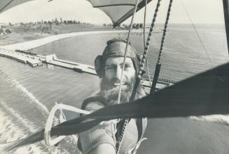 High above Lake Ontario is Michael Robertson who rides a kite as high as 1,000 feet as part of the Aquarama show at the CNE. A member of the Flying Ci(...)