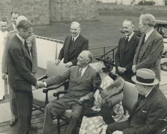 Forerunner of world-shattering events was this comely, informal scene at Quebec when British Foreign Secretary Anthony Eden greeted President Roosevel(...)