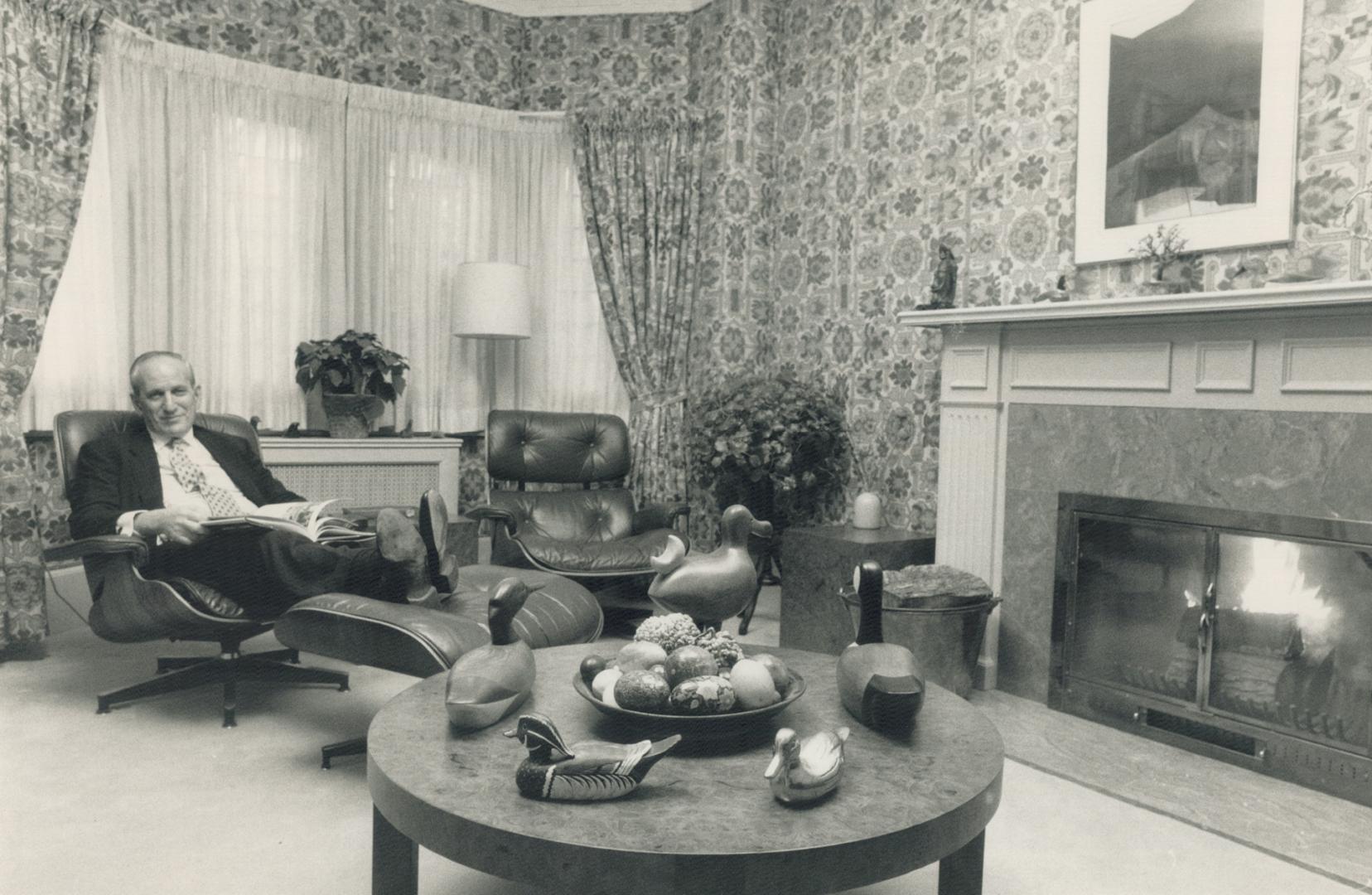 Roomy den: Harry Rosen relaxes in one of two leather chairs in his den where he retreats to recharge his batteries