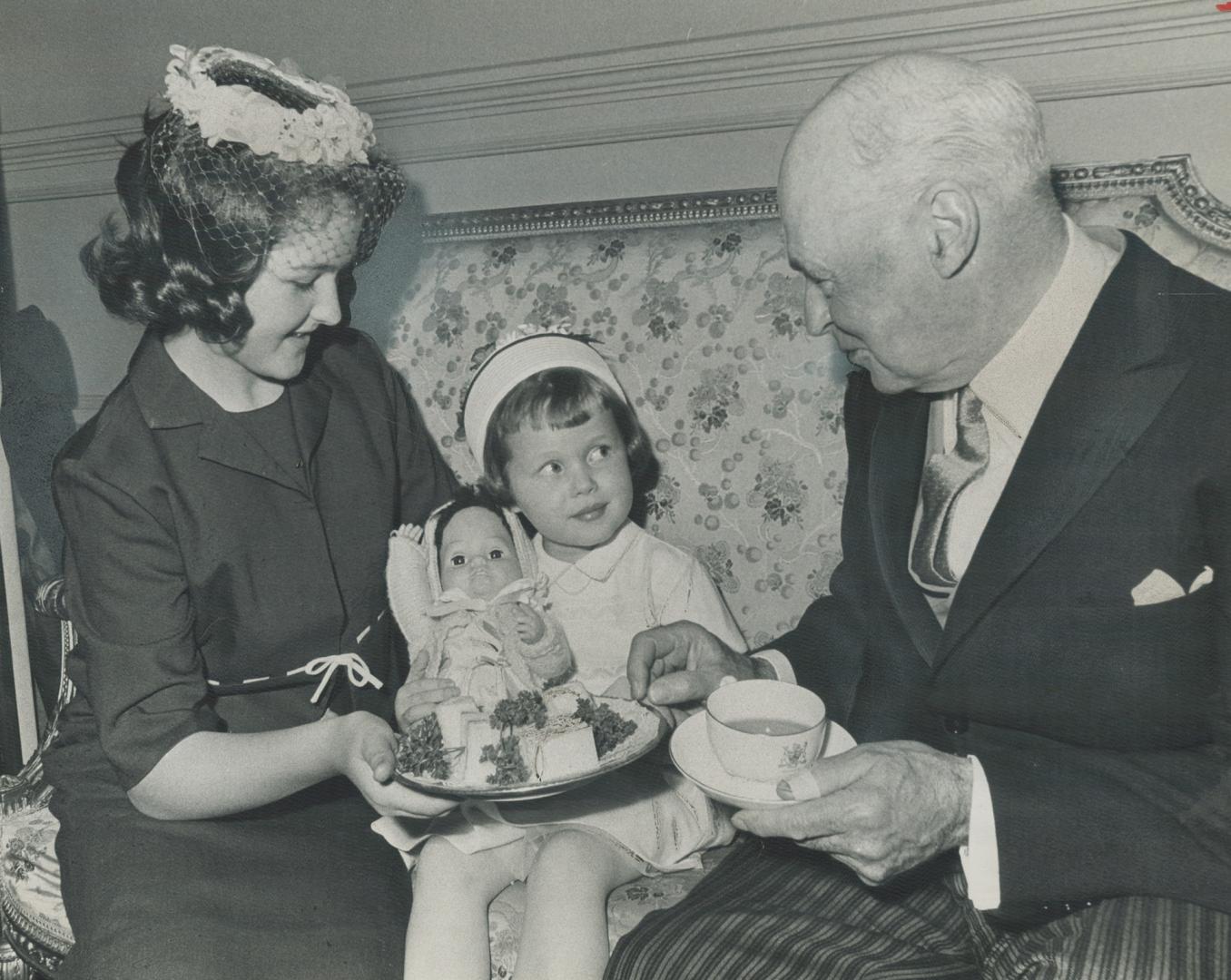 Lt.-Gov. Earl Rowe is well looked after by grandchildren. At inaugural reception yesterday, Jane Rowe, 14, Cynthia Rowe, 5, serve granddad