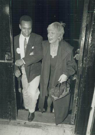 New mayor: A victorious June Rowlands, accompanied by campaign supporter Michael Crooks, arrives at her Masonic Temple victory party last night