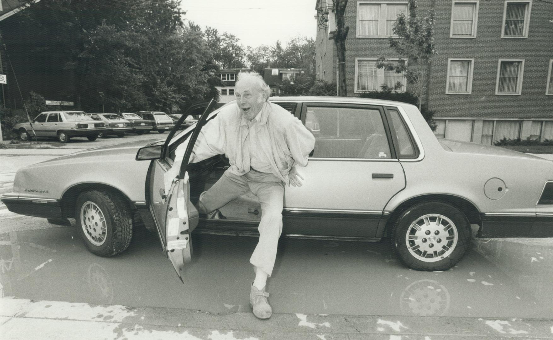 What's the rush? Jan Rubes, leading actor of stage, screen and tube, is trying to avoid one of Toronto's newest regular features - mud puddles. Here h(...)