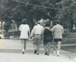 Seeking answers: Joe Sabatino, right, brother of shooting victim Dominic Sabatino, their mother, second from right, an uncle and a neighbor want to know why police shot the mentally disturbed man