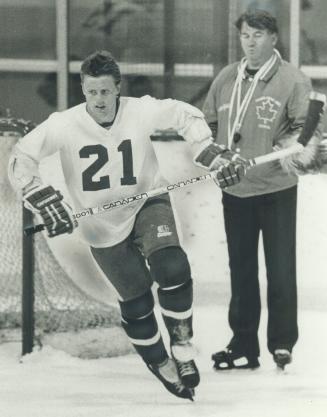 The boss is watching, Borje. Veteran defenceman Borje Salming limbers up under the watchful eye of coach Mike Nykoluk at the Maple Leafs' scrimmage in(...)