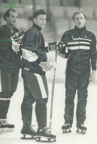 The skating wounded. Defencemen Brad Maxwell (left) and Borje Salming confer with Toronto Maple Leafs coach Dan Maloney during practice yesterday. Nei(...)