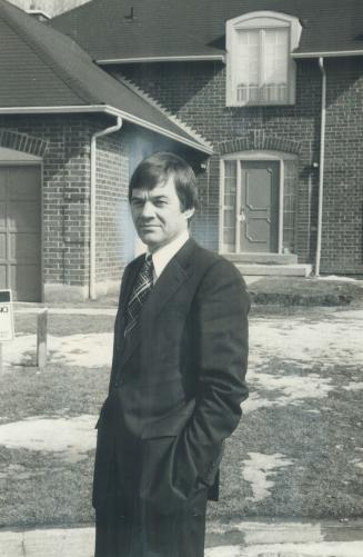 Buoyant builder: John Sandusky, pictured in front of one of his houses, says new homes today are available at bargain prices