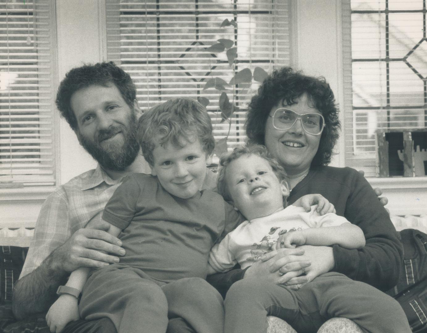 Leave for dad: Shalom Schachter sits with his wife Marcia Gilbert and sons Matya, 4, and Cliel, 2 after finding out he has won a federal court case involving paternity leave