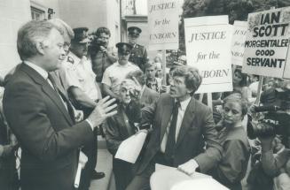 Abortion protesters heckle Scott