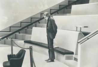 Toronto alderman John Sewell, defeated 25-2 in the Metro chairmanship election, stands alone in the council chamber during the prayer. Sewell says he (...)