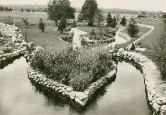 Inmates of the Ontario Reformatory at Guelph have made this beauty spot where formerly ran a weedy little stream