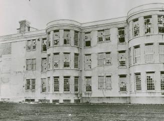 Windows at the reformatory were smashed during the rioting and glass littered the floors inside the building and out in the courtyard