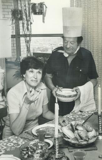 Grand repast: Saul Baker, 70, serves wife, Esther, gourmet dinner made in Saul's kitchen.