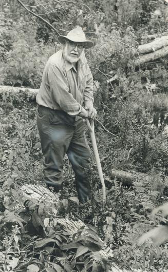 Controversy surrounds, survival instructor Berndt Berglund's professional claims and a federal government department has shelved plans to employ him. He is seen working in swamp area near National Wilderness Survival school, which has received more than $74,000 in government grants since last November.