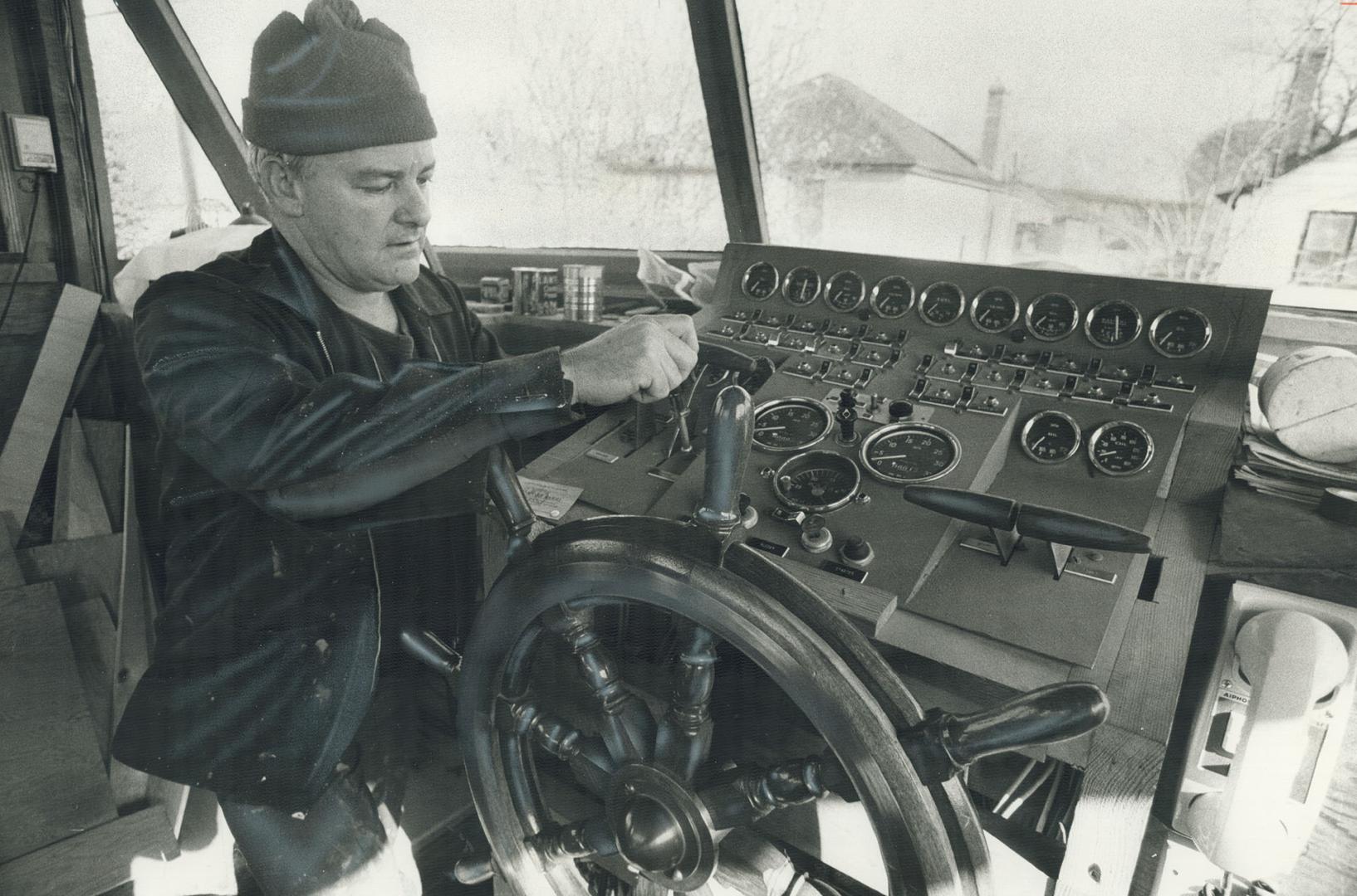 Brown checks controls and instruments. Vessel is powered by 3 diesel engines, Just as incredible as the amount of work put into the boat is the co-operation of Brown's neighbors.