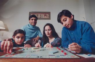 No Christmas: Atiya Burney, 11, left, her father Ali, mother Sabiha and brother llyas, 12, feel free to be different.